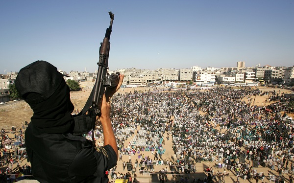 A Palestinian militant holds up a rifle during an anti-Israel rally in the northern Gaza Strip